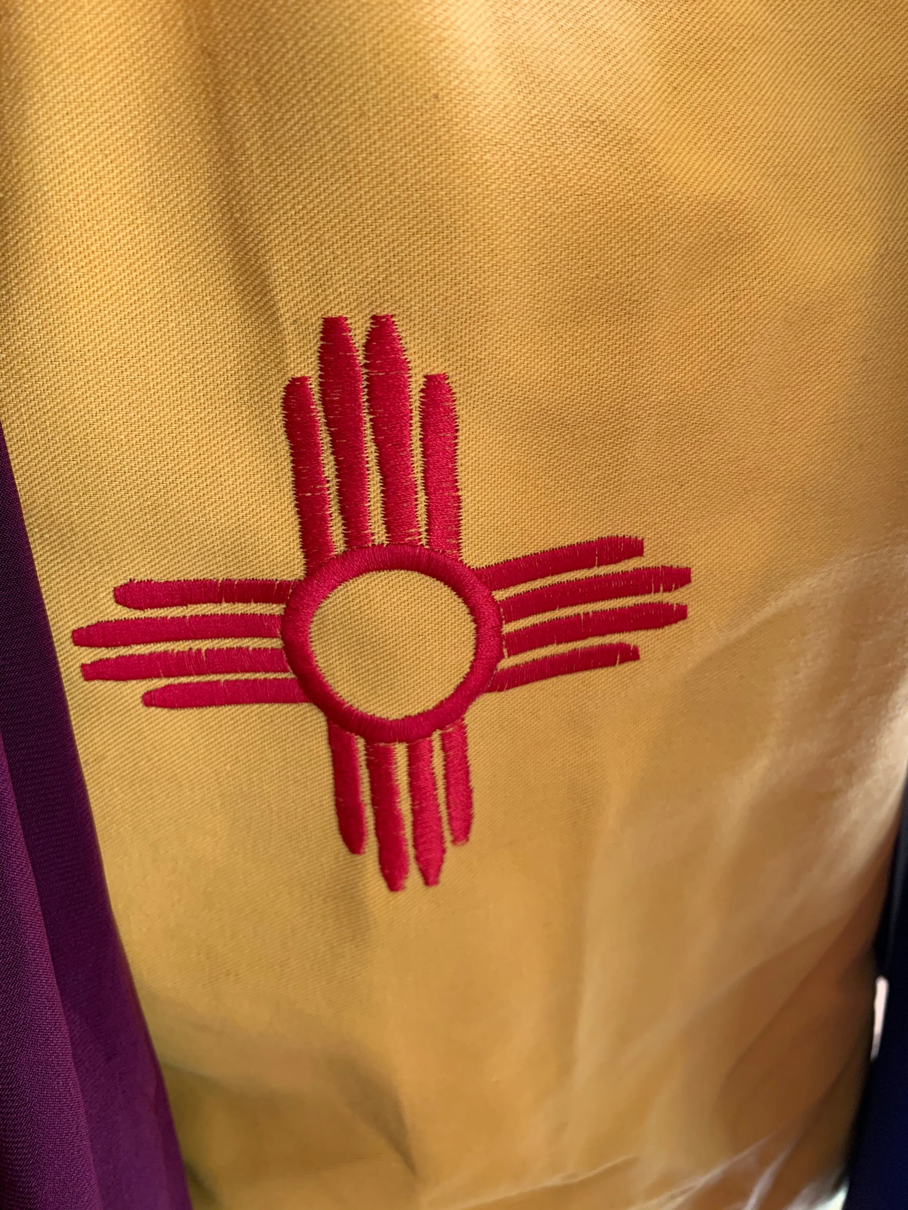 New Mexico True Aprons; Embroidered Zia Symbol
